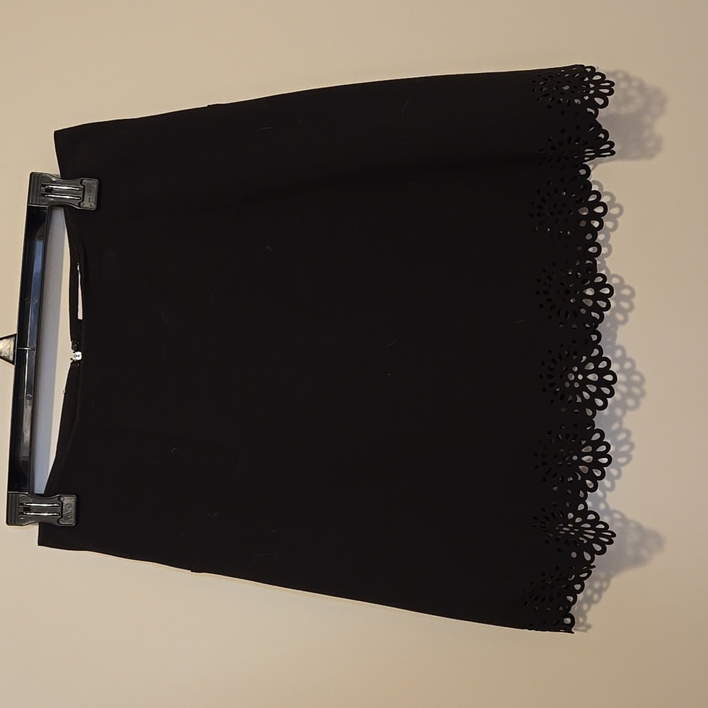 Two A-line black petite skirts